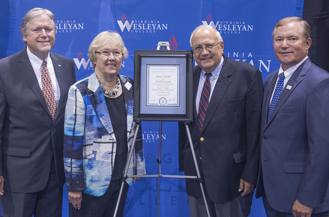 Susan and David Goode (center) were recognized during the State of the College Address on August 23 following the announcement of the Susan S. Goode School of Arts and Humanities. Also pictured are Dr. Timothy G. O'Rourke, Provost and Vice President for Academic Affairs (left), and Dr. Scott D. Miller, President of the College (right).