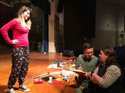 STAGE PRESENCE: Theater teacher Amy Insley (right), VWC Class of 1997, reviews notes with York High School students prior to their April performance of "Footloose." (Photo courtesy of WYDaily.com)