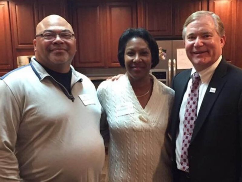 Troy DeLawrence '93 (left) and Mavis McKenley '11 (center) with President Scott D. Miller