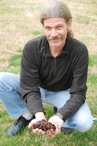 EARTH ANGELS: Worms turn food waste into nutrient-rich soil, says Dr. Rock, shown here with handful of his squirming friends.