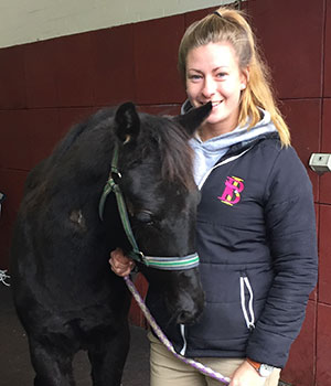 Kellen Phillips '18 (Biology) at her internship at the Randwick Equine Centre in Randwick, Australia, June 2017. She is photographed with her favorite patient, a Warmblood colt. Photograph by Megan Bartels.