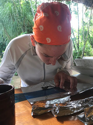 Monika Metro '19 (Biology) conducting arachnid analysis in San Ignancio, Belize, June 2018. Anonymous photographer.