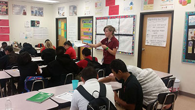 Whitney Symons '15 (Biology) teaches 7th graders at Risley International Academy of Innovation in Pueblo, Colorado how drugs affect their bodies