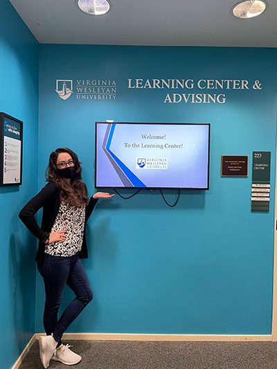 Jamie at the main entrance of The Learning Center, March 2021. (Photo by Emily Duval)