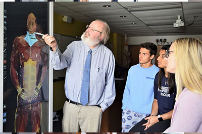 Professor of Biology Vic Townsend demonstrates capabilites of VWU's newly acquired Anatomage Table for seniors