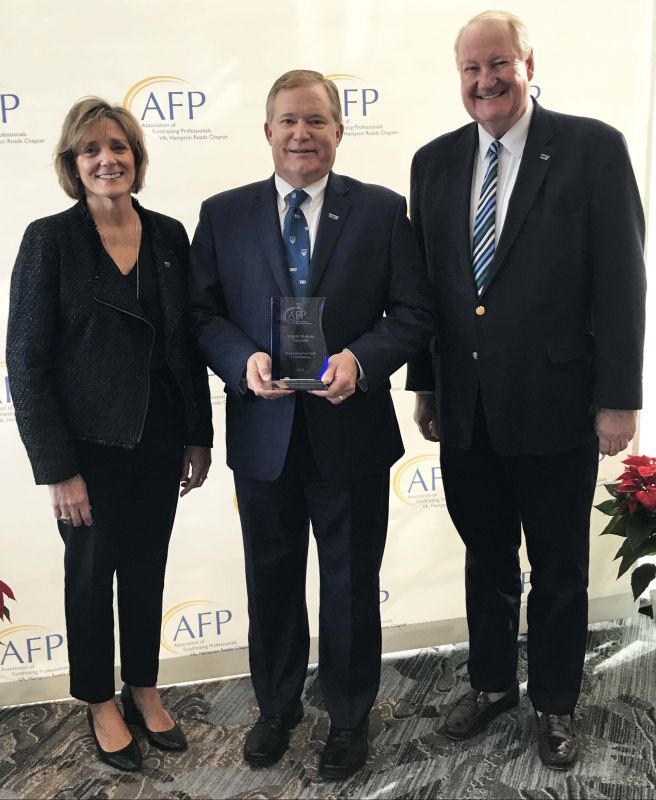President Scott D. Miller and Senior Vice President Mort Gamble accept the Outstanding Non-Profit in Fundraising award from Laurie Harrison, President of the Association of Fundraising Professionals Hampton Roads Chapter.