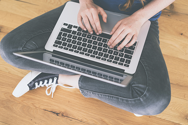 Person typing on a laptop computer