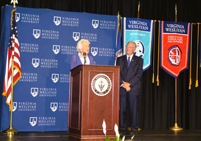 Jane Batten at podium with VWU President Scott Miller