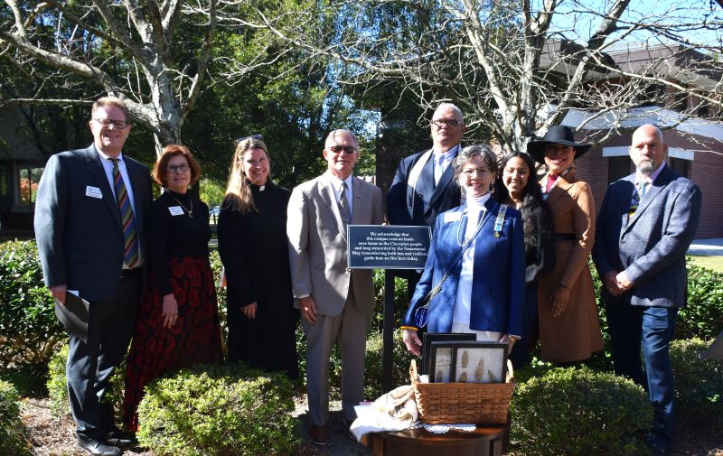 Repatriation Ceremony in VWU's Peace Garden: (From left) Craig Wansink, Kelly Jackson, Rev. Melissa Sumner Long, VWU President Scott D. Miller, Chief Keith Anderson, Jackie Murray, Gabrielle Barnett, Assistant Chief Nikki Bass, Thomas Badamo